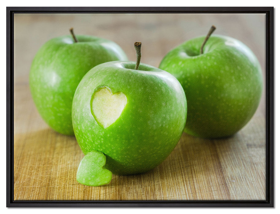 ein Herzchen im Apfel auf Leinwandbild gerahmt Größe 80x60