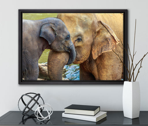 Elefantenmutter mit Kalb auf Leinwandbild gerahmt mit Kirschblüten