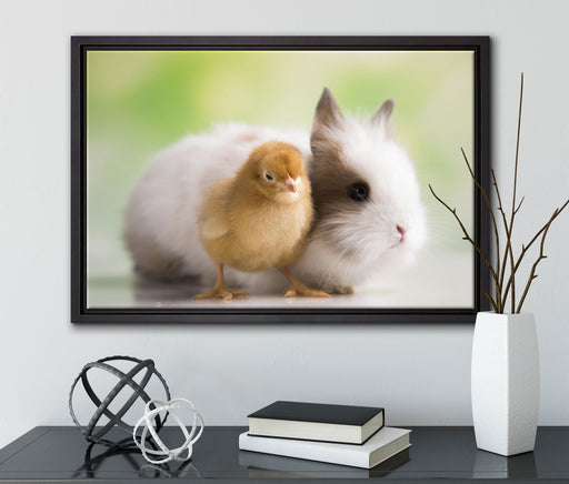 kleines Küken mit süßem Häschen auf Leinwandbild gerahmt mit Kirschblüten