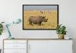 großes Nashorn mit Zebrahorde auf Leinwandbild gerahmt verschiedene Größen im Wohnzimmer