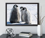 drei Kaiserpinguinküken auf Leinwandbild gerahmt mit Kirschblüten
