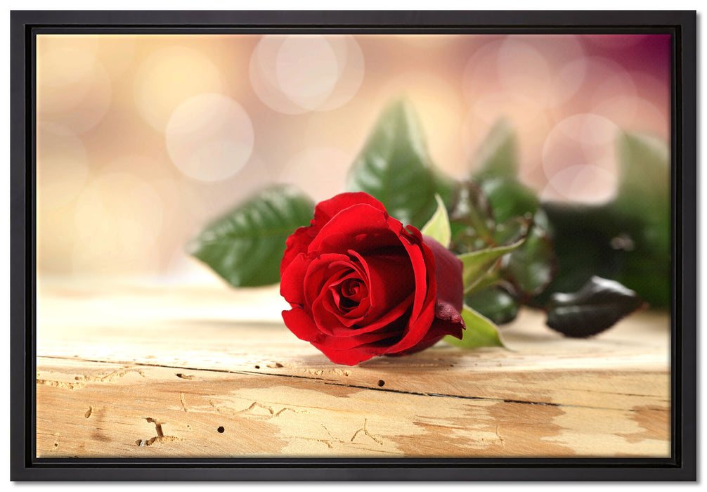 Rose auf Holztisch auf Leinwandbild gerahmt Größe 60x40