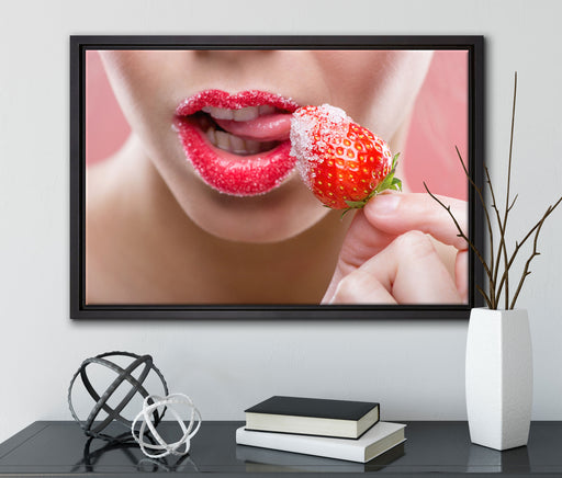 Erdbeere vor Lippen auf Leinwandbild gerahmt mit Kirschblüten