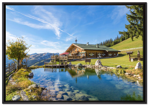 Schönes Haus in den Alpen auf Leinwandbild gerahmt Größe 100x70