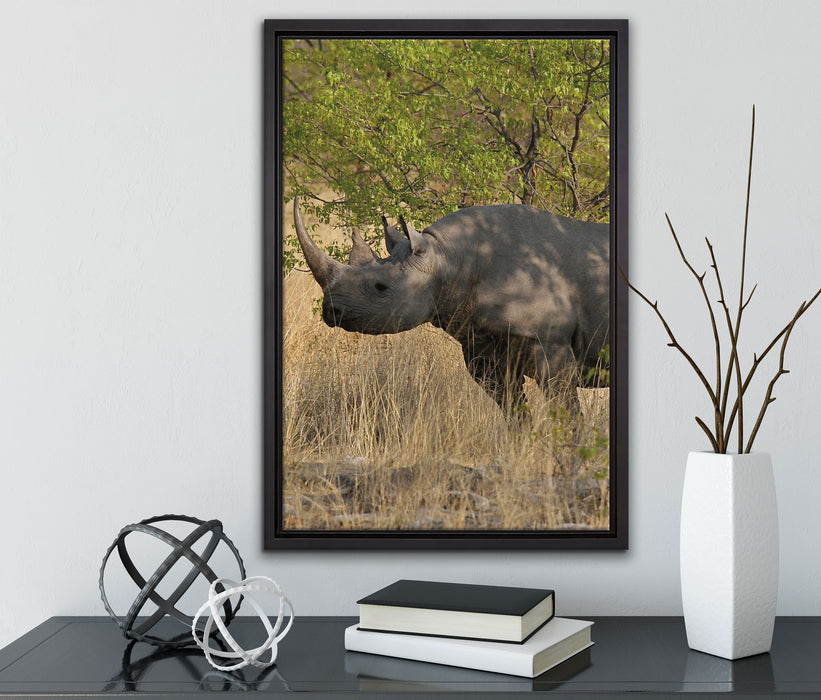 Nashorn in der Savanne auf Leinwandbild gerahmt mit Kirschblüten