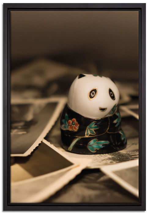 Panda Figur zwischen Fotografien auf Leinwandbild gerahmt Größe 60x40