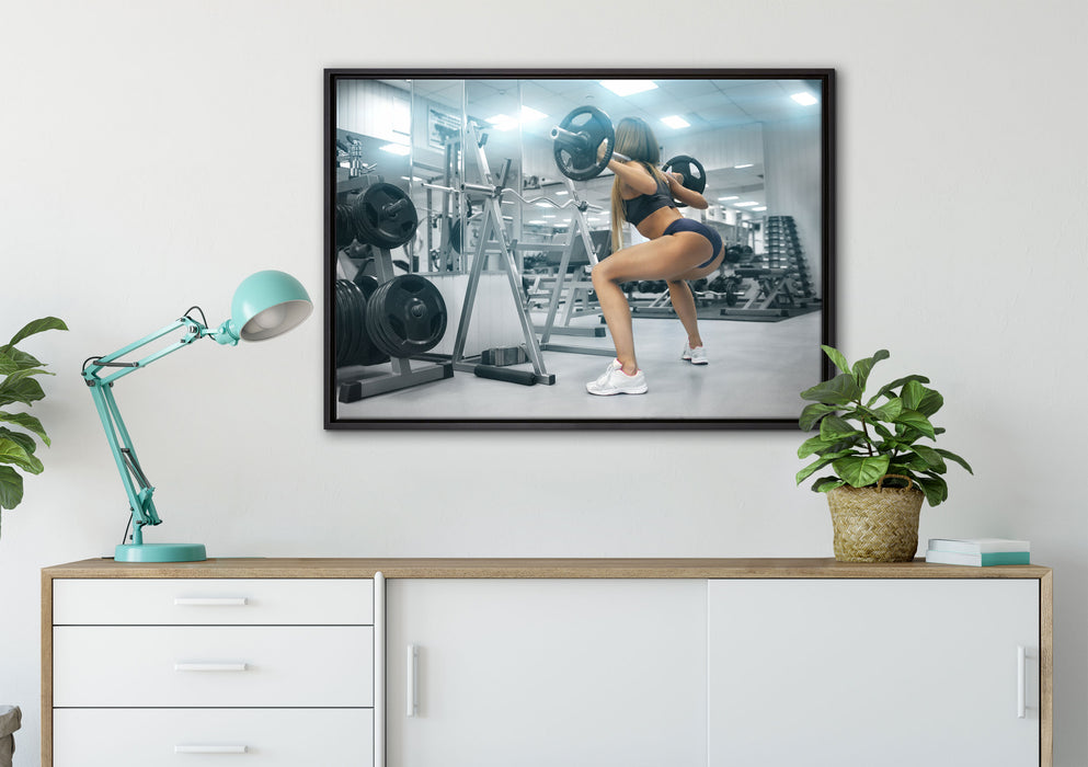 Sportliche Frau mit Hantelstange auf Leinwandbild gerahmt verschiedene Größen im Wohnzimmer