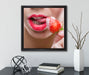 Erdbeere vor Lippen  auf Leinwandbild Quadratisch gerahmt mit Kirschblüten