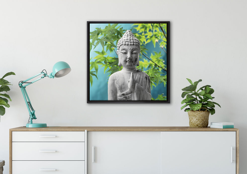 Buddha auf Steinen mit Monoi Blüte auf Leinwandbild gerahmt Quadratisch verschiedene Größen im Wohnzimmer