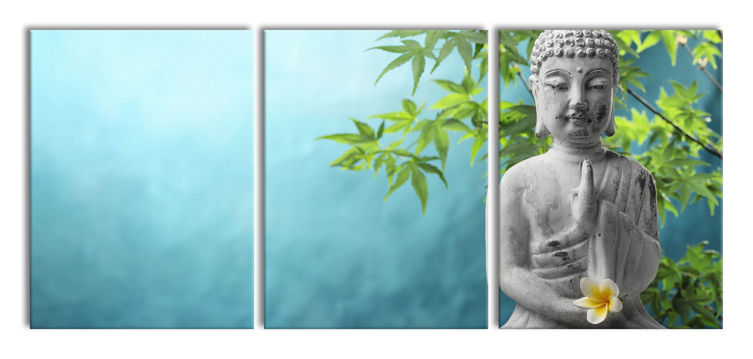 Buddha auf Steinen mit Monoi Blüte, XXL Leinwandbild als 3 Teiler